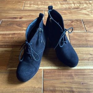 Black zip up ankle bootie. Great with jeans.